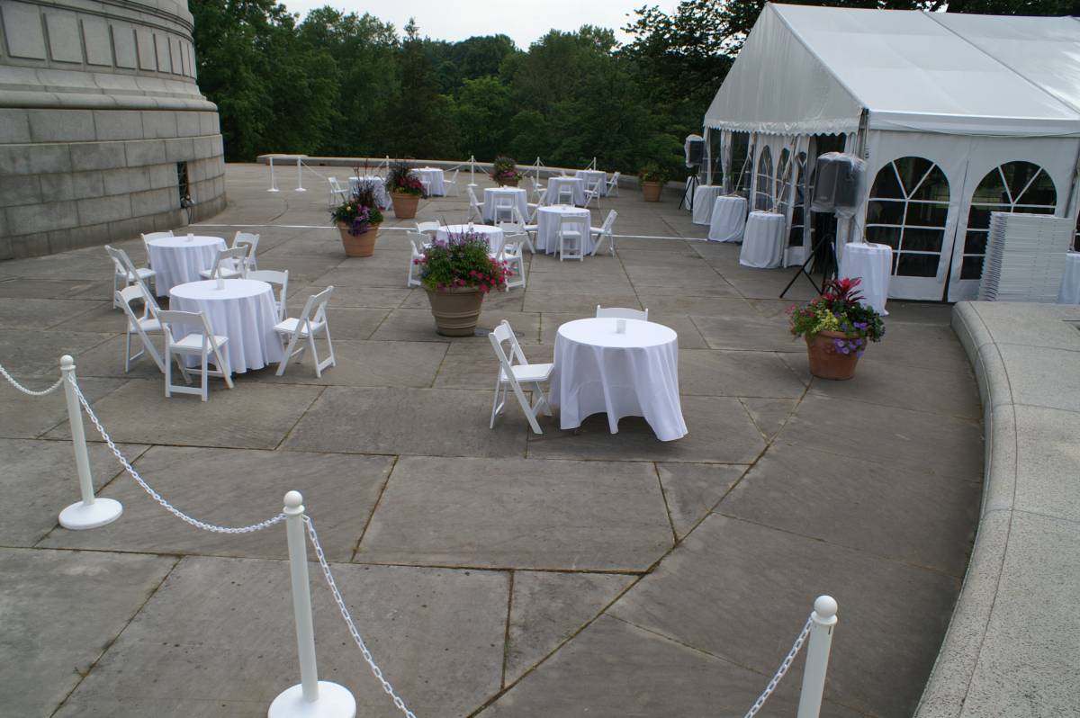 Table 36" Round Wood Topped With 90" Round White Solid Tablecover And White Garden Chairs